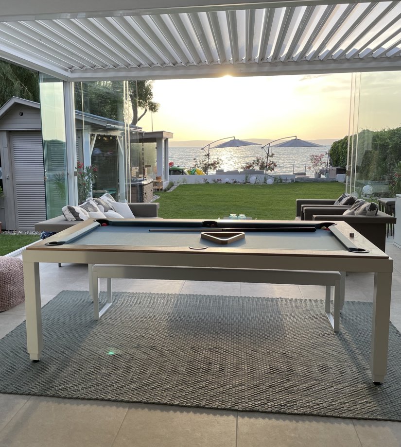 Convertible dining pool table shown with top off to reveal playing surface